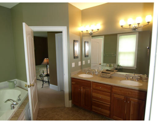18 Corn Road Bolton, MA 01740 - Photo 9 of 12 a bathroom with a sink double vanity granite tub and a mirror