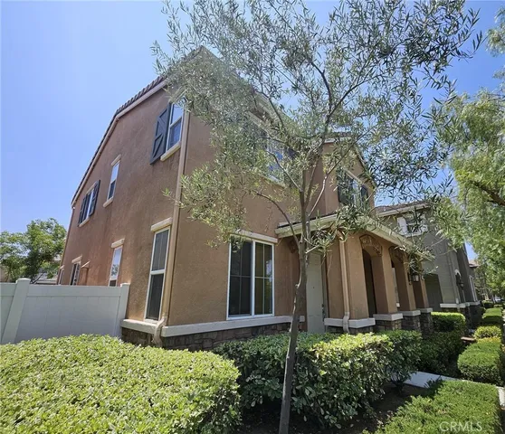 front view of a house with a small yard