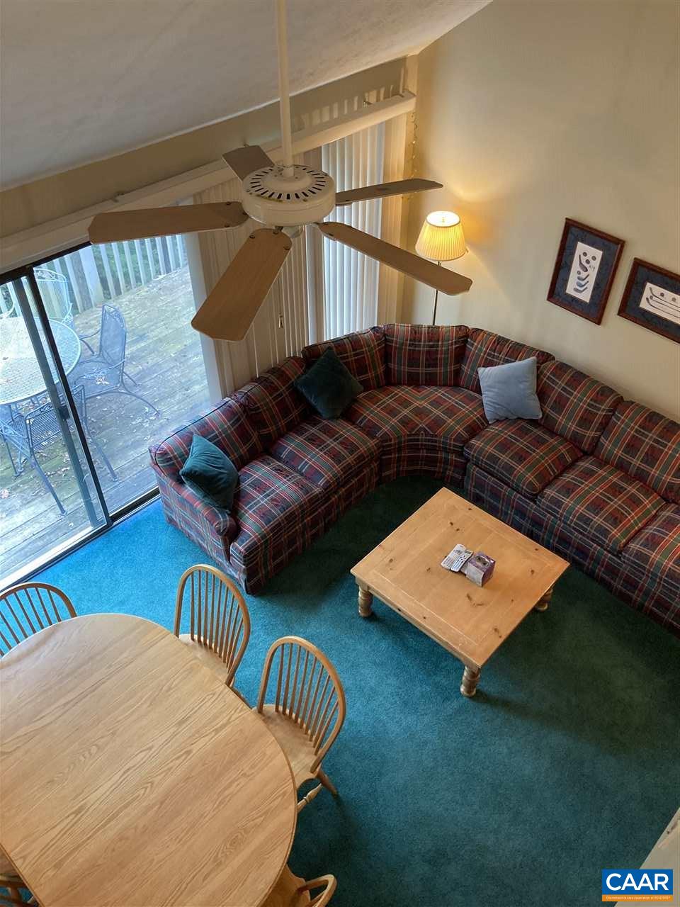 409 3 Ridges Roseland, VA 22967 - Photo 17 of 19 a living room with furniture and a book shelf