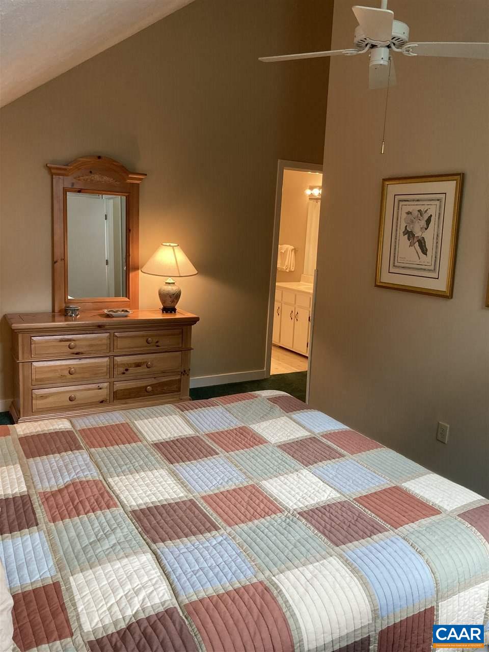409 3 Ridges Roseland, VA 22967 - Photo 10 of 19 a bedroom with a bed and a lamp on dresser