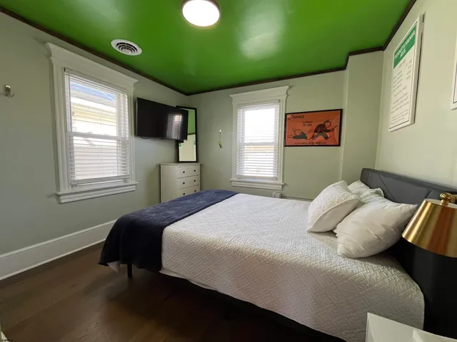 a bedroom with a bed and a window