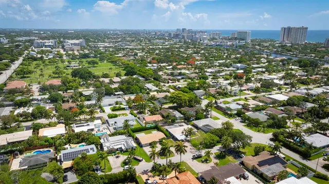 an aerial view of residential houses with outdoor space