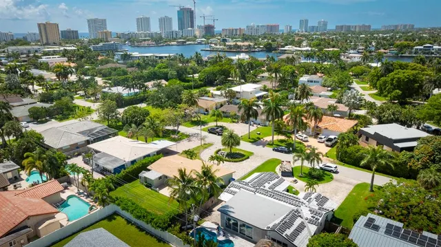 a view of a backyard with plants and patio