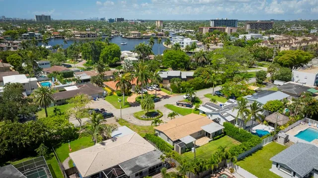 a view of a backyard with plants and patio