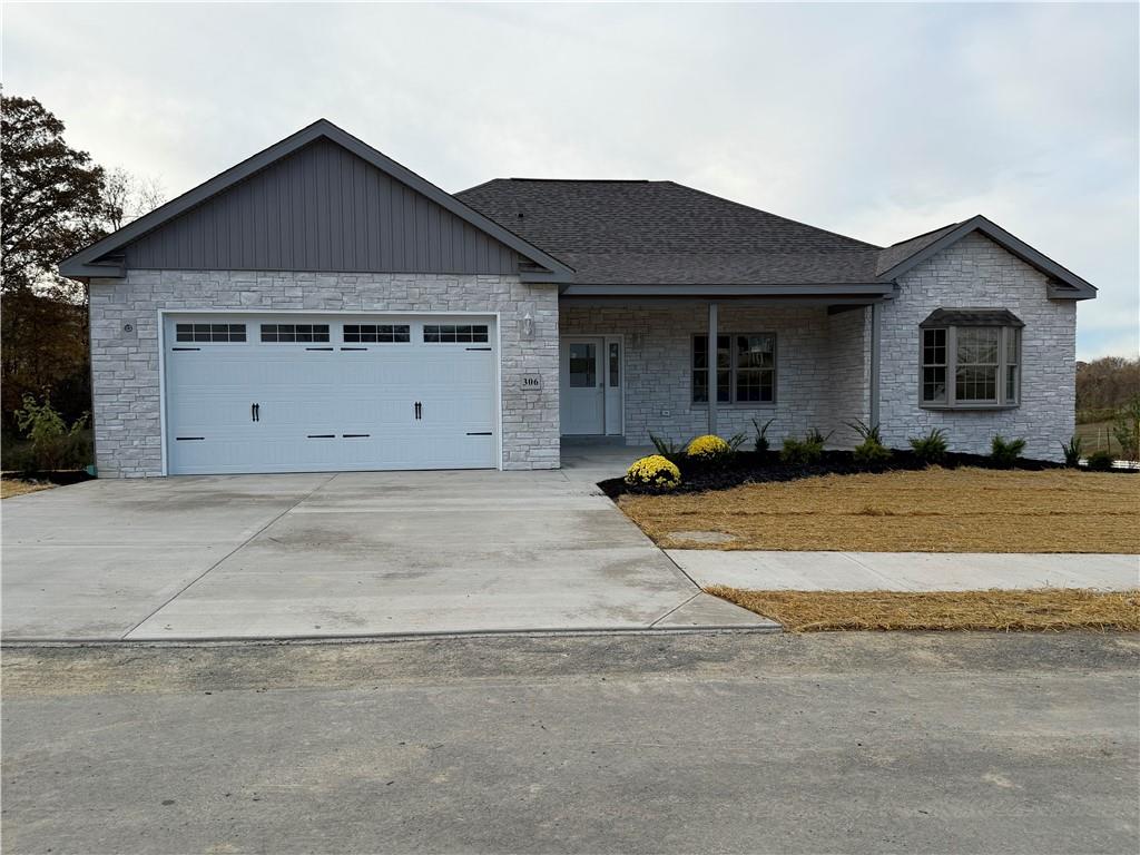 306 Hunters Crossing Canonsburg, PA 15317 - Photo 2 of 27 a front view of a house with a garden