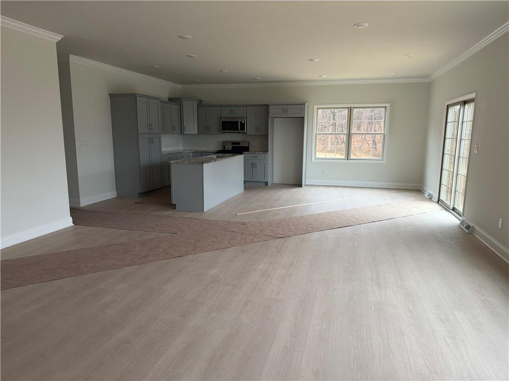 306 Hunters Crossing Canonsburg, PA 15317 - Photo 24 of 27 a view of a kitchen with a sink dishwasher and a refrigerator