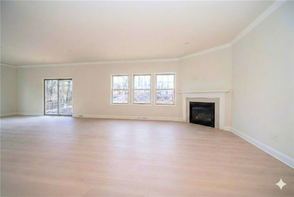 306 Hunters Crossing Canonsburg, PA 15317 - Photo 8 of 28 an empty room with windows and fireplace