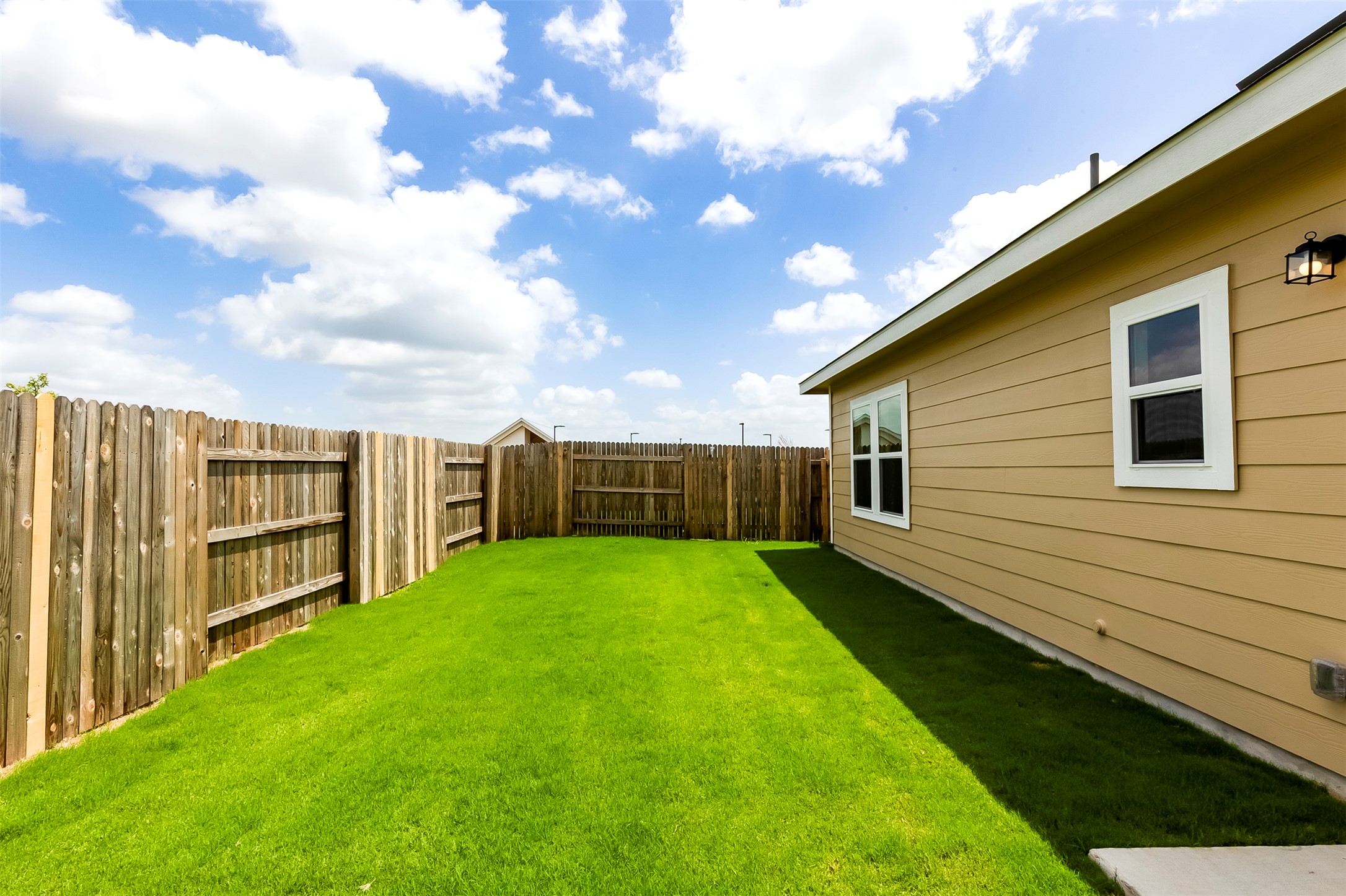 274 Jade Street Maxwell, TX 78656 - Photo 23 of 36 a view of a backyard with a small cabin