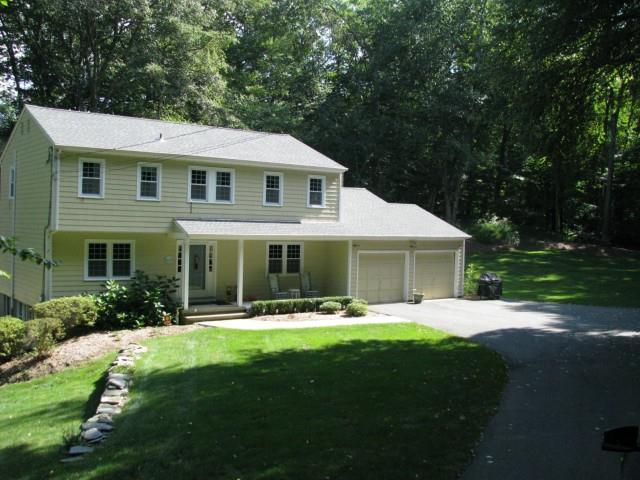 7 Hemmelskamp Road Wilton, CT 06897 - Photo 1 of 1 a front view of house with yard outdoor seating and green space