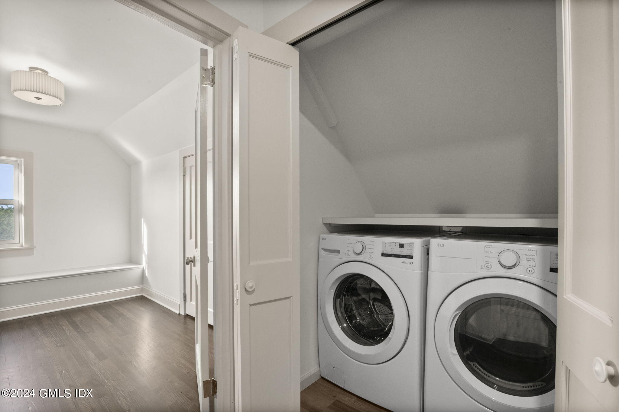 109 Byram Road, Unit B Greenwich, CT 06830 - Photo 17 of 25 a view of a hallway with washer and dryer