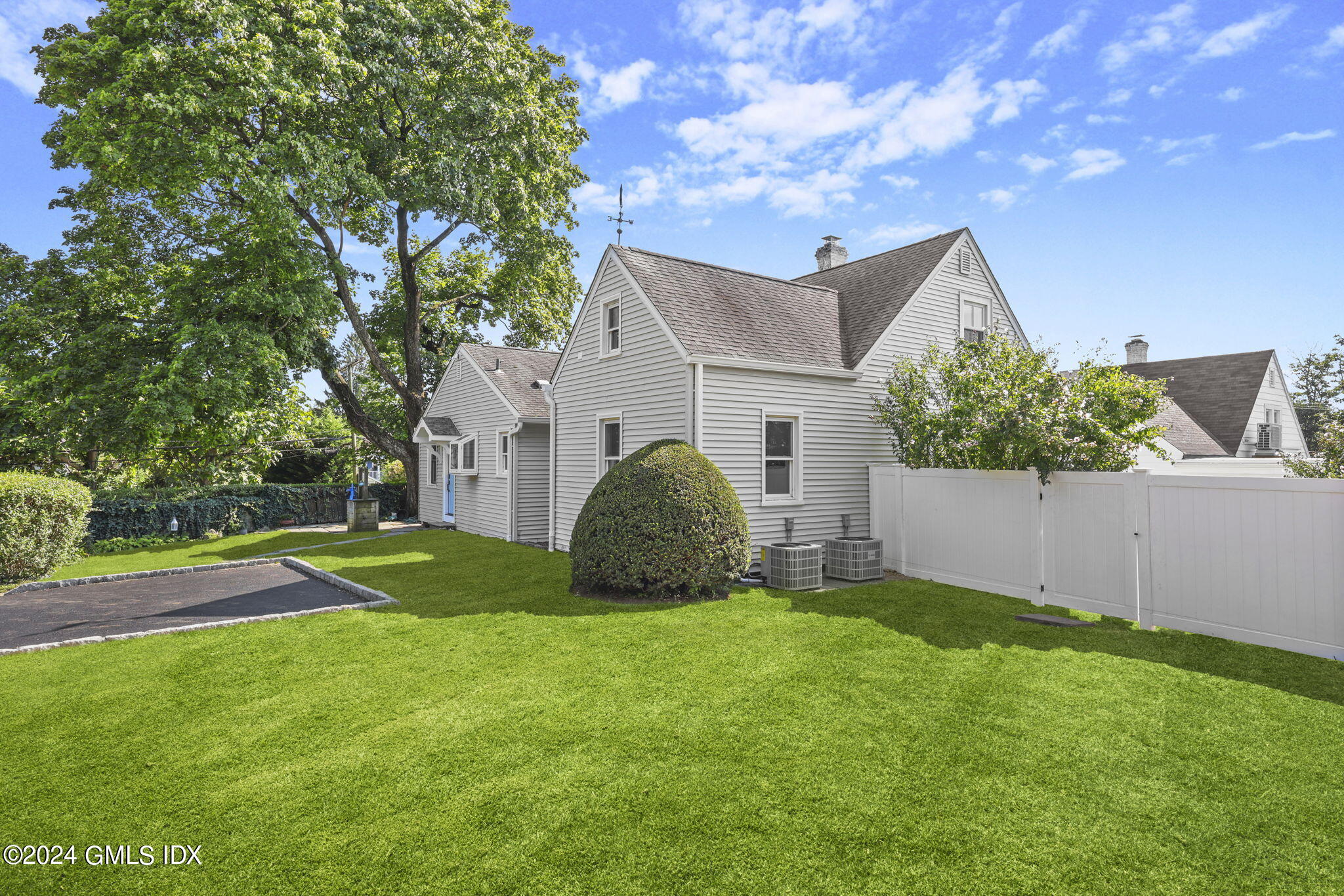 109 Byram Road, Unit B Greenwich, CT 06830 - Photo 2 of 25 a view of a yard in front of a house