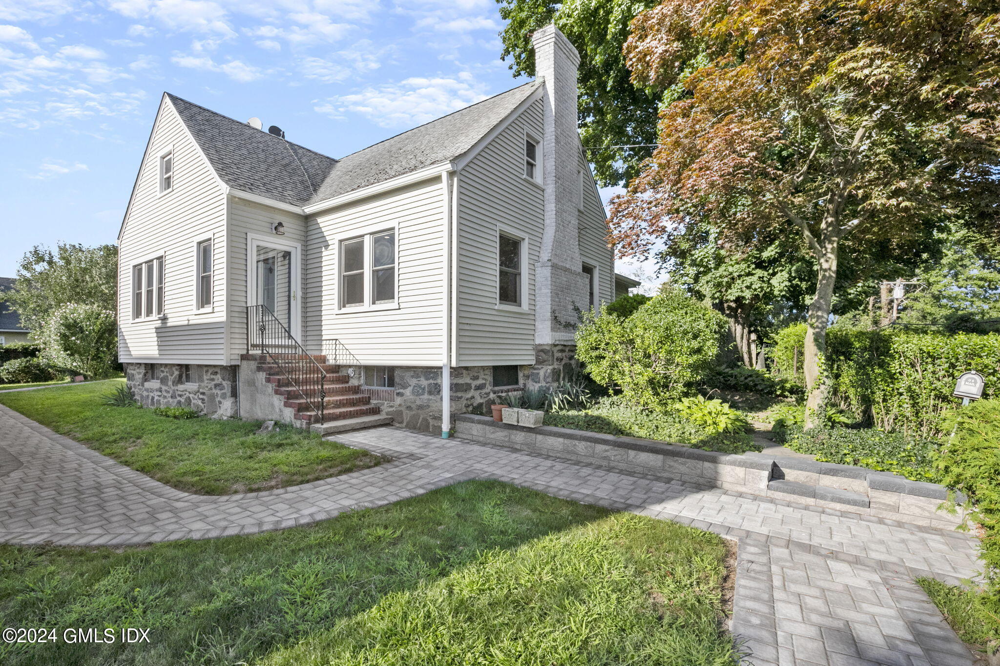 109 Byram Road, Unit B Greenwich, CT 06830 - Photo 24 of 25 a view of a house with a yard
