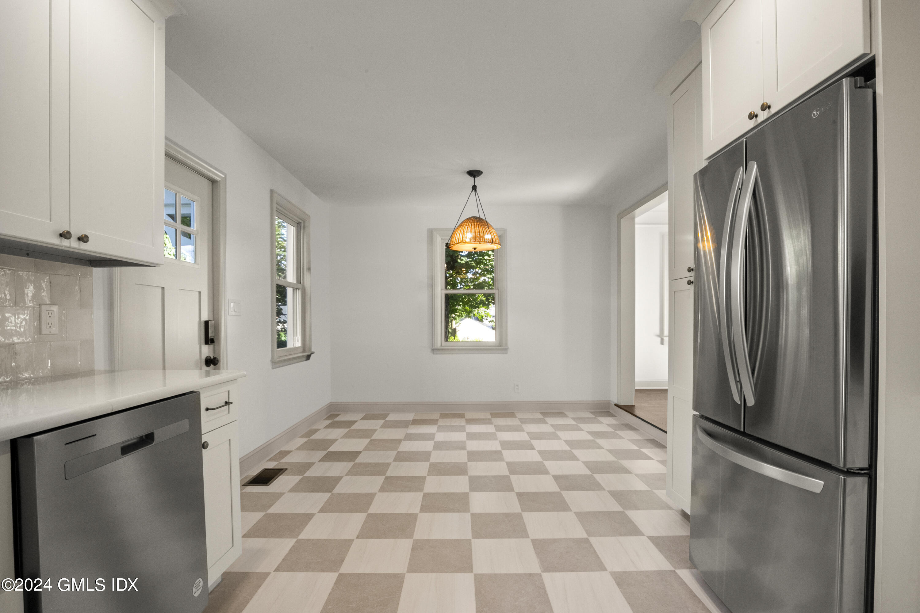 109 Byram Road, Unit B Greenwich, CT 06830 - Photo 8 of 25 a view of a refrigerator in kitchen and a window