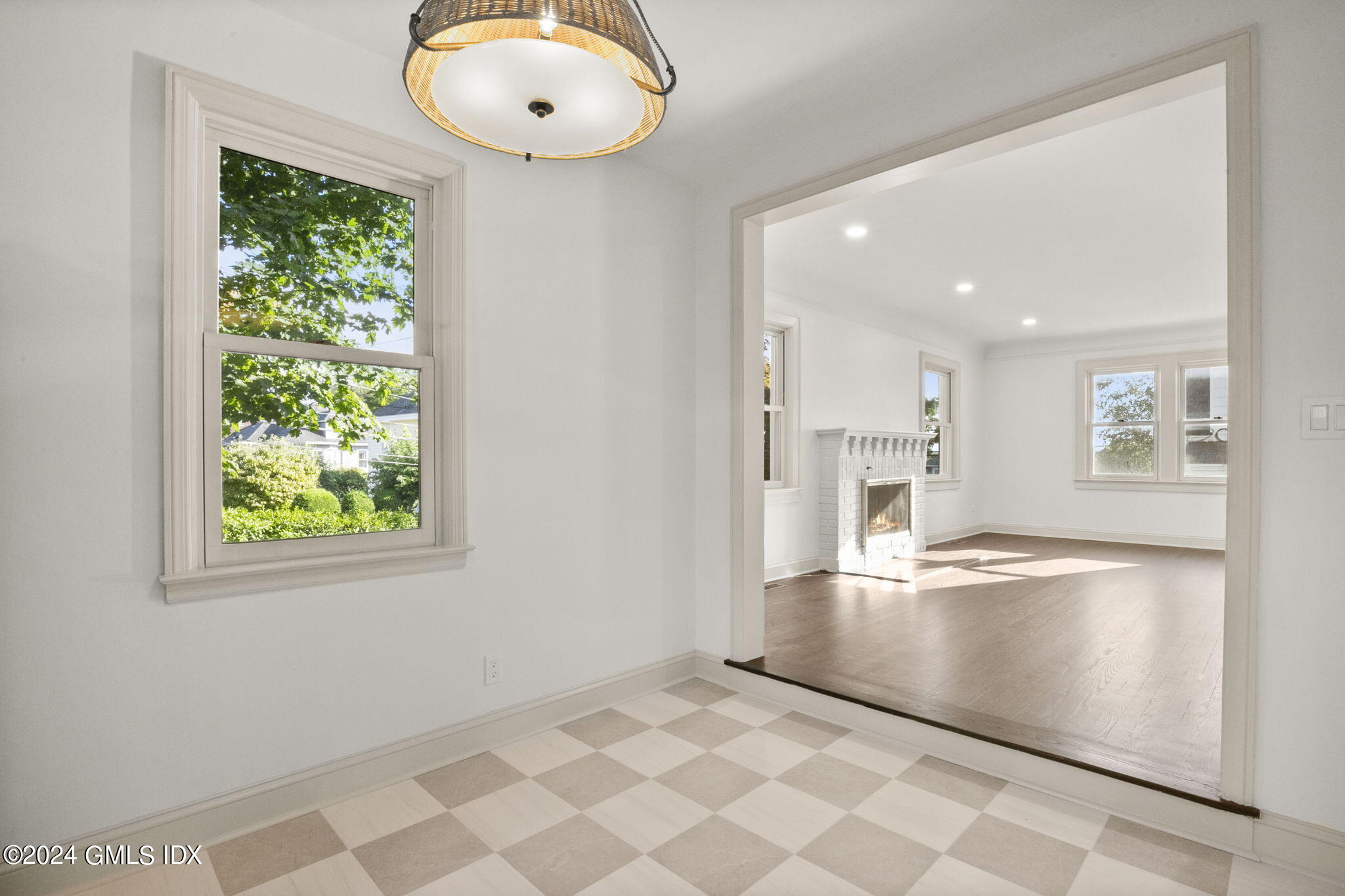 109 Byram Road, Unit B Greenwich, CT 06830 - Photo 9 of 25 a view of empty room with wooden floor and fan