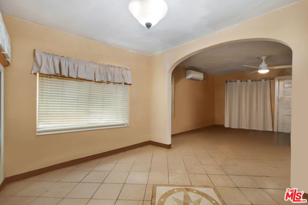 4713 Clinton Street Los Angeles, CA 90004 - Photo 12 of 25 a view of an empty room with a window