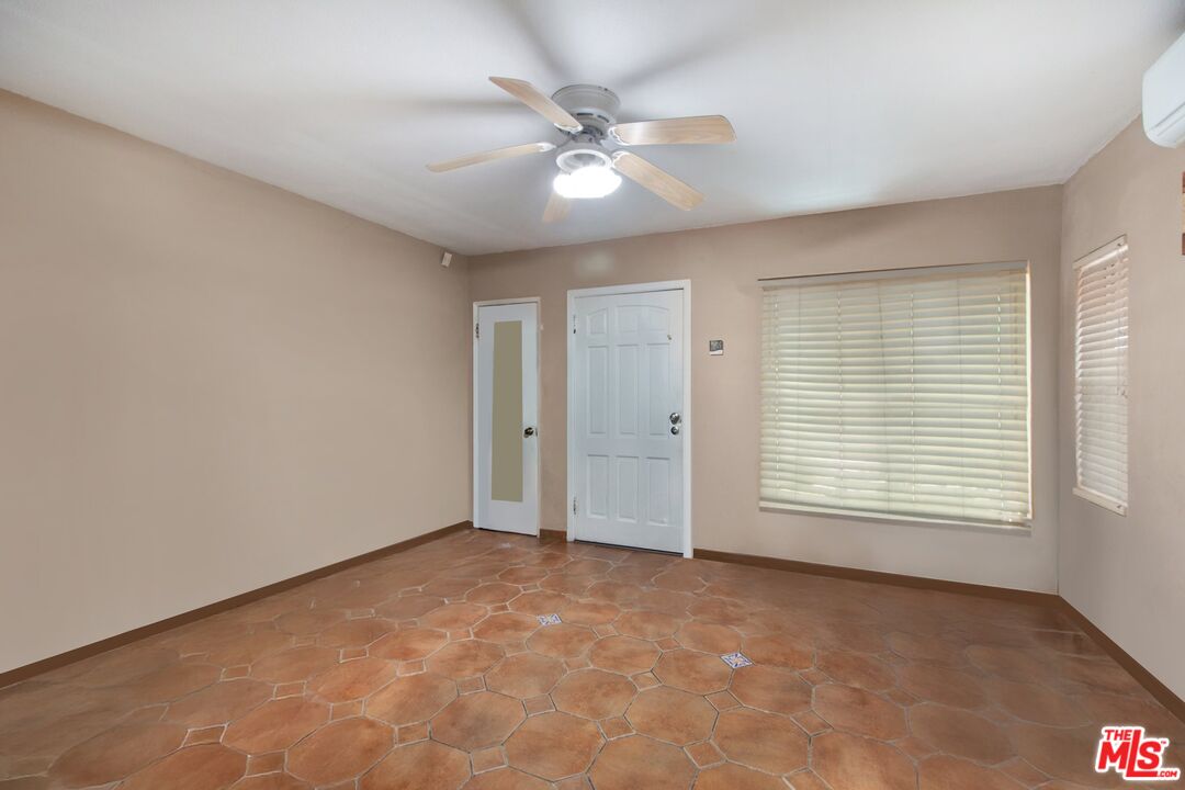 4713 Clinton Street Los Angeles, CA 90004 - Photo 2 of 25 a view of an empty room with a window
