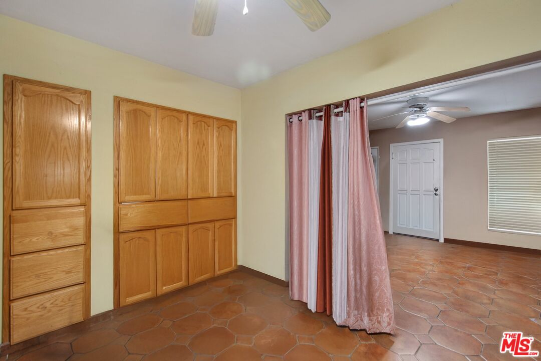 4713 Clinton Street Los Angeles, CA 90004 - Photo 3 of 25 a view of a room with wooden floor and a bathroom