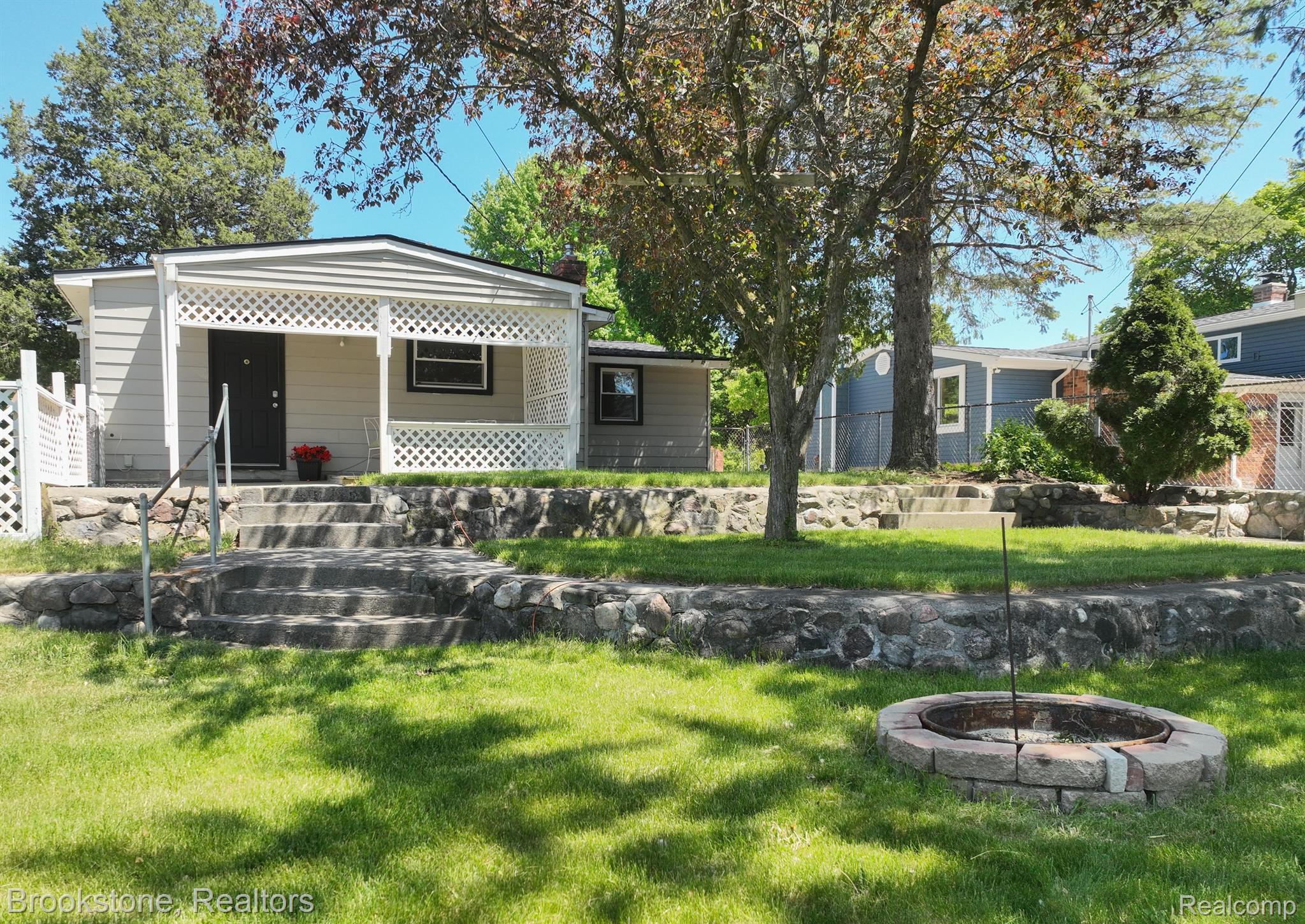 798 Pine Tree Road Lake Orion, MI 48362 - Photo 6 of 23 Spend time around the fire
