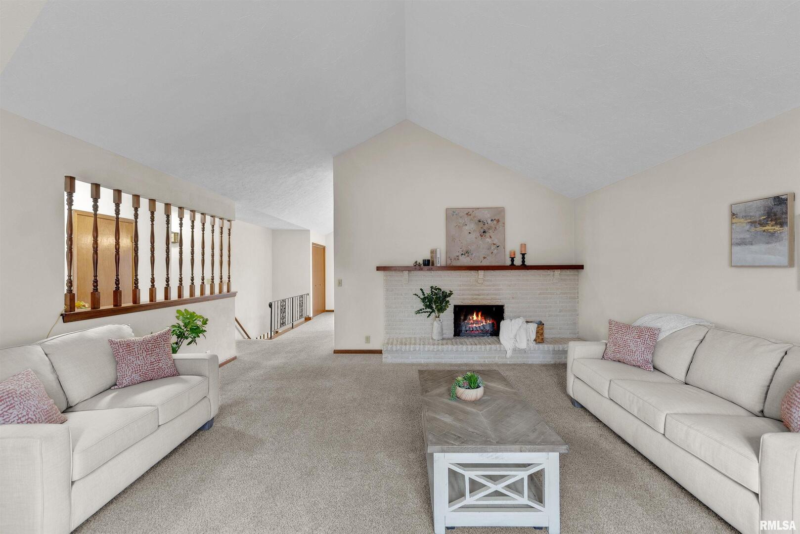 209 Lake View Court Colona, IL 61241 - Photo 3 of 32 a living room with furniture and a couch