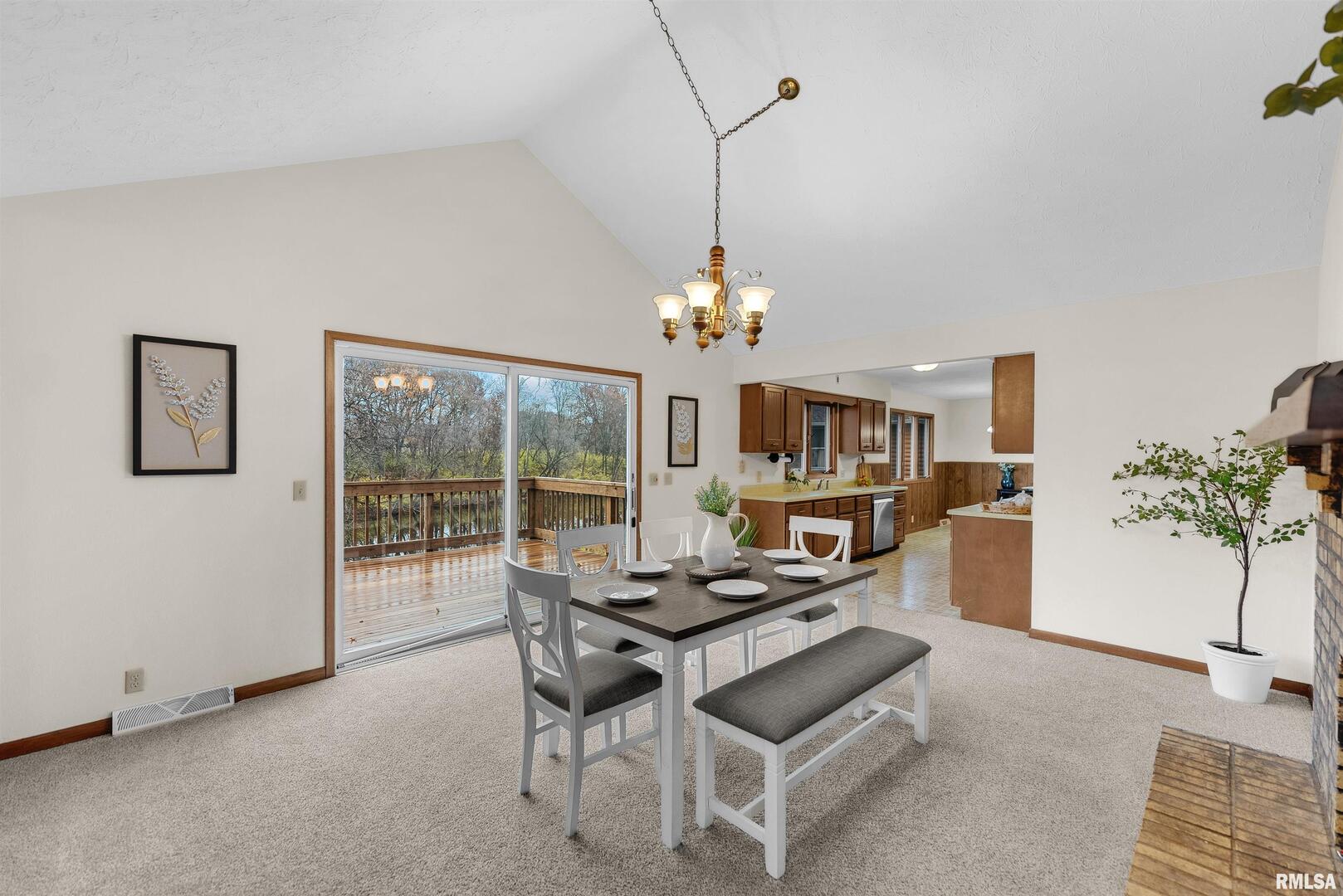 209 Lake View Court Colona, IL 61241 - Photo 4 of 32 a workspace with furniture and a chandelier