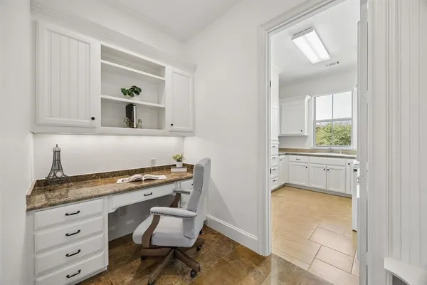 a room that has a dresser and a chair in it