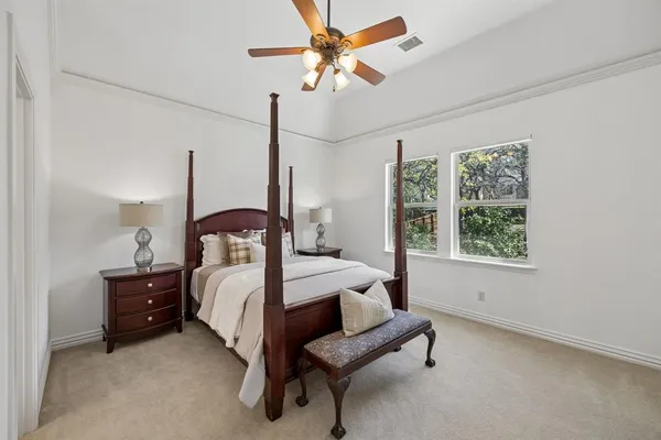 a bed room with a bed and a window