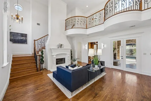 a living room with furniture fireplace and flat screen tv
