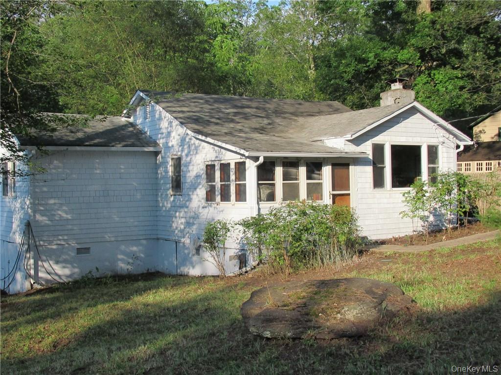 View of front of house with a front yard