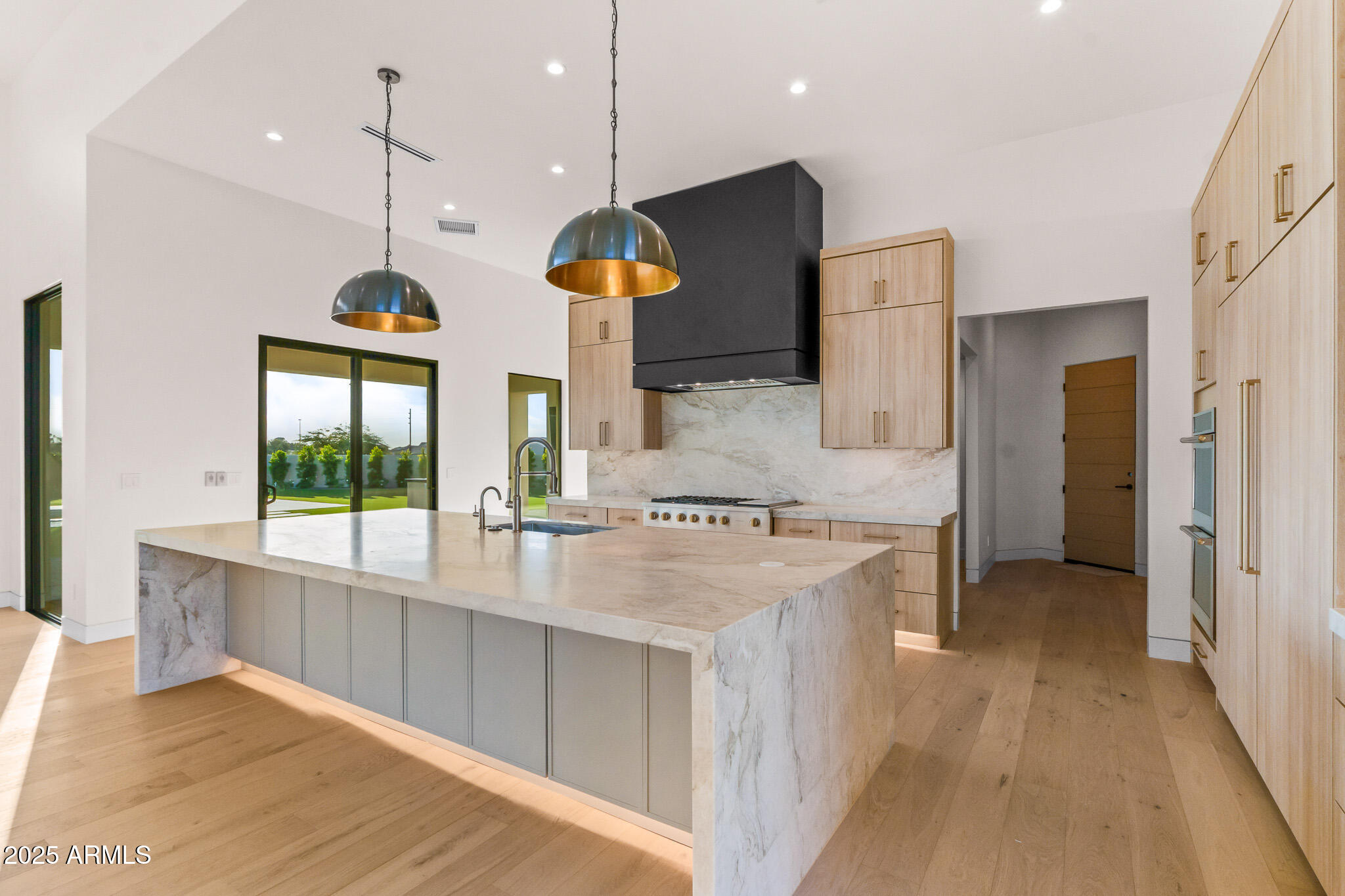 6260 South Key Biscayne Court Gilbert, AZ 85298 - Photo 11 of 68 a kitchen with stainless steel appliances granite countertop a stove and refrigerator