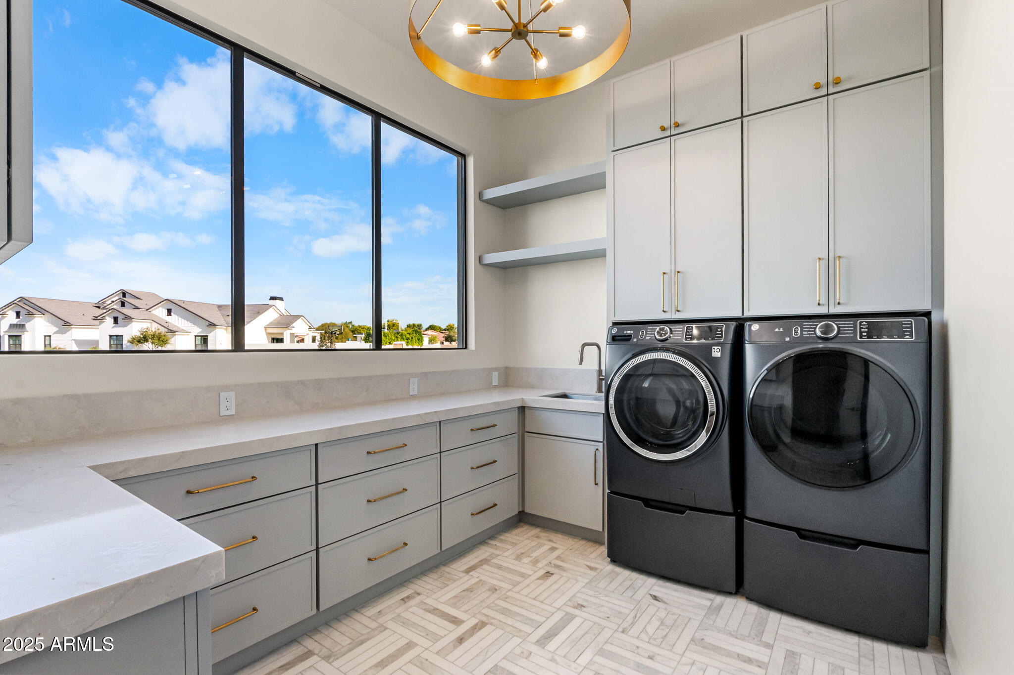 6260 South Key Biscayne Court Gilbert, AZ 85298 - Photo 20 of 68 a utility room with dryer and washer