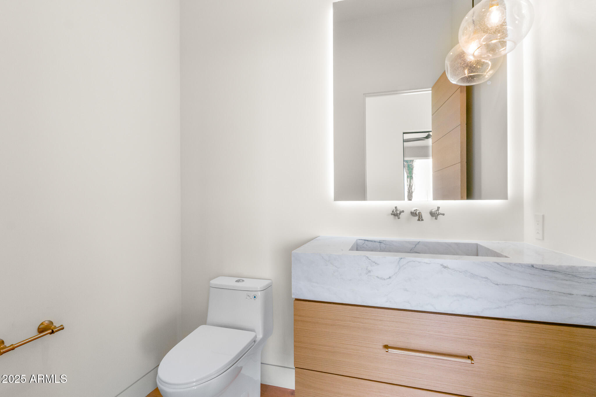 6260 South Key Biscayne Court Gilbert, AZ 85298 - Photo 21 of 68 a bathroom with a granite countertop toilet sink and mirror