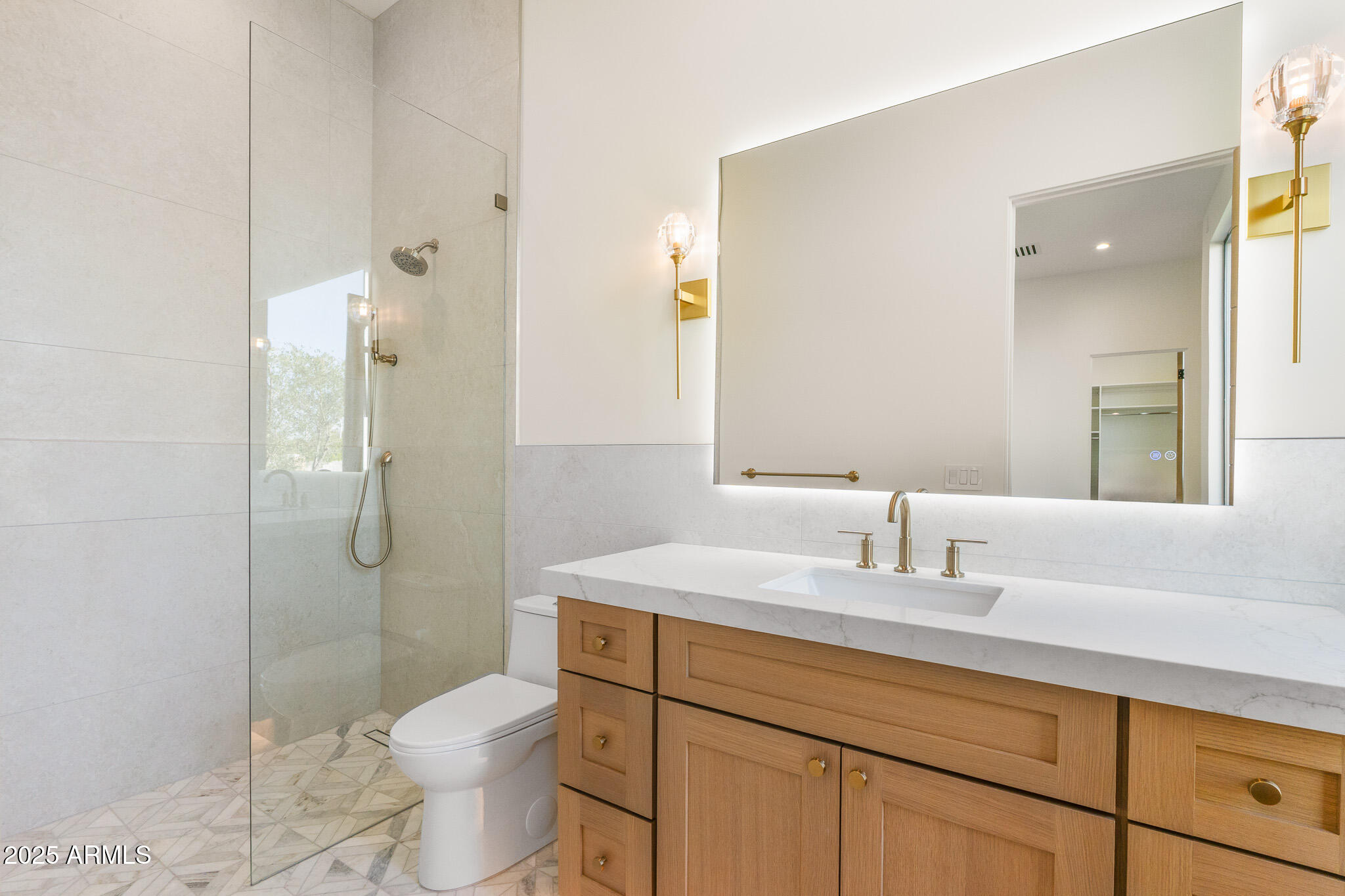6260 South Key Biscayne Court Gilbert, AZ 85298 - Photo 38 of 68 a bathroom with a sink toilet vanity and shower