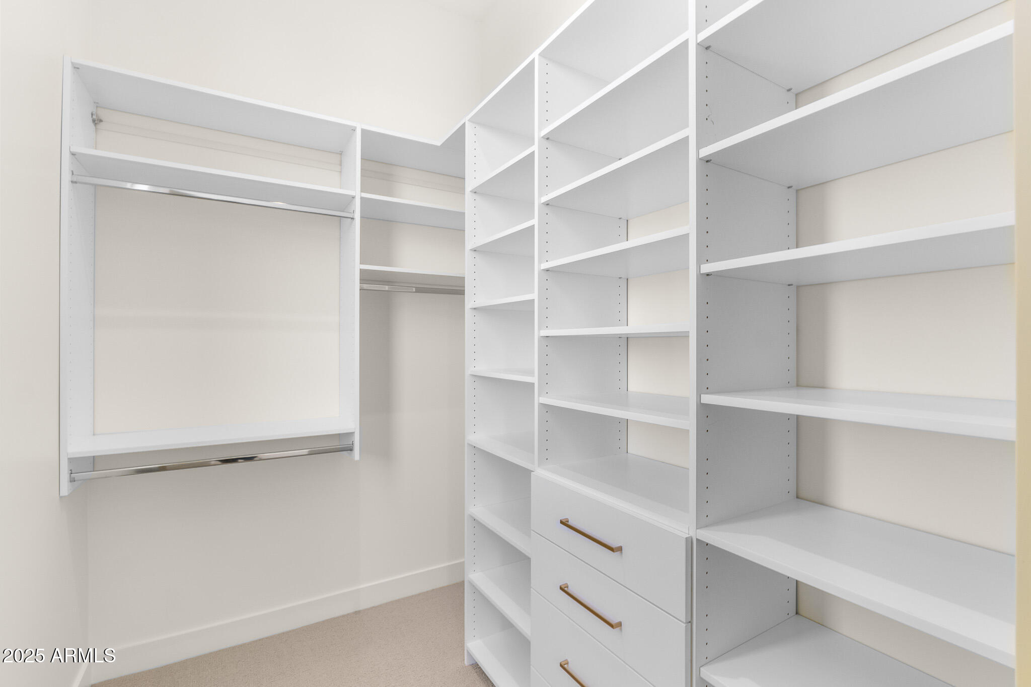 6260 South Key Biscayne Court Gilbert, AZ 85298 - Photo 39 of 68 a view of walk in closet with empty racks