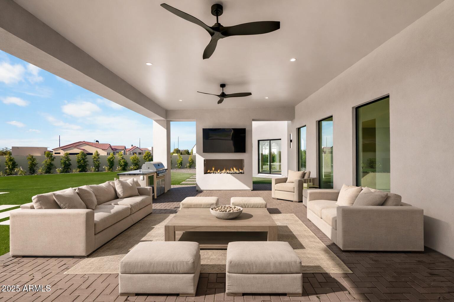 6260 South Key Biscayne Court Gilbert, AZ 85298 - Photo 40 of 68 a living room with furniture fireplace and a flat screen tv