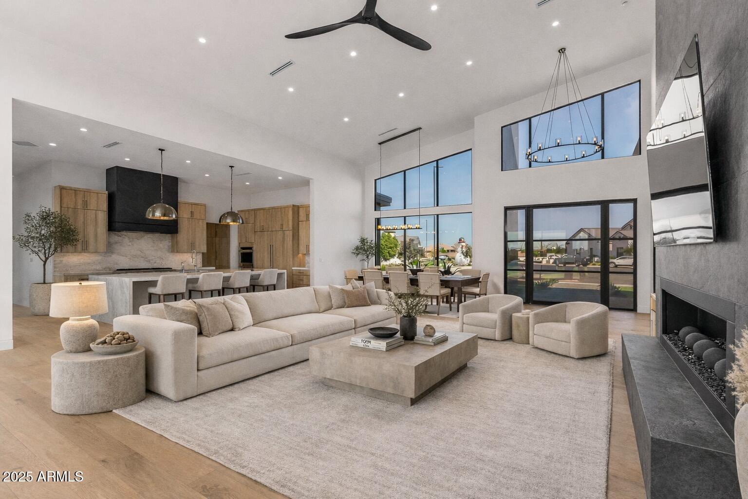 6260 South Key Biscayne Court Gilbert, AZ 85298 - Photo 4 of 68 a living room with furniture fireplace and a view of kitchen