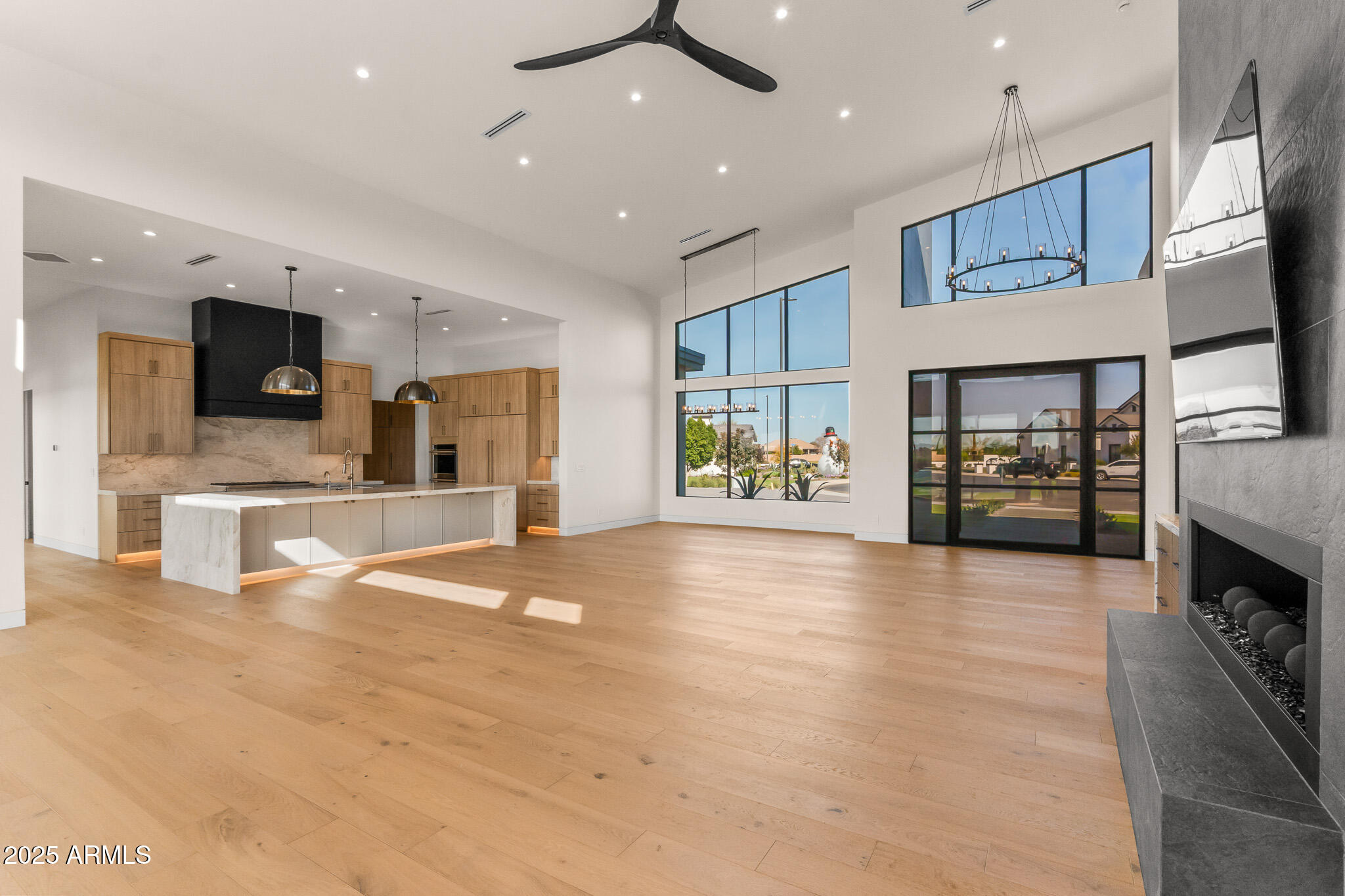 6260 South Key Biscayne Court Gilbert, AZ 85298 - Photo 8 of 68 a view of an empty room with a kitchen