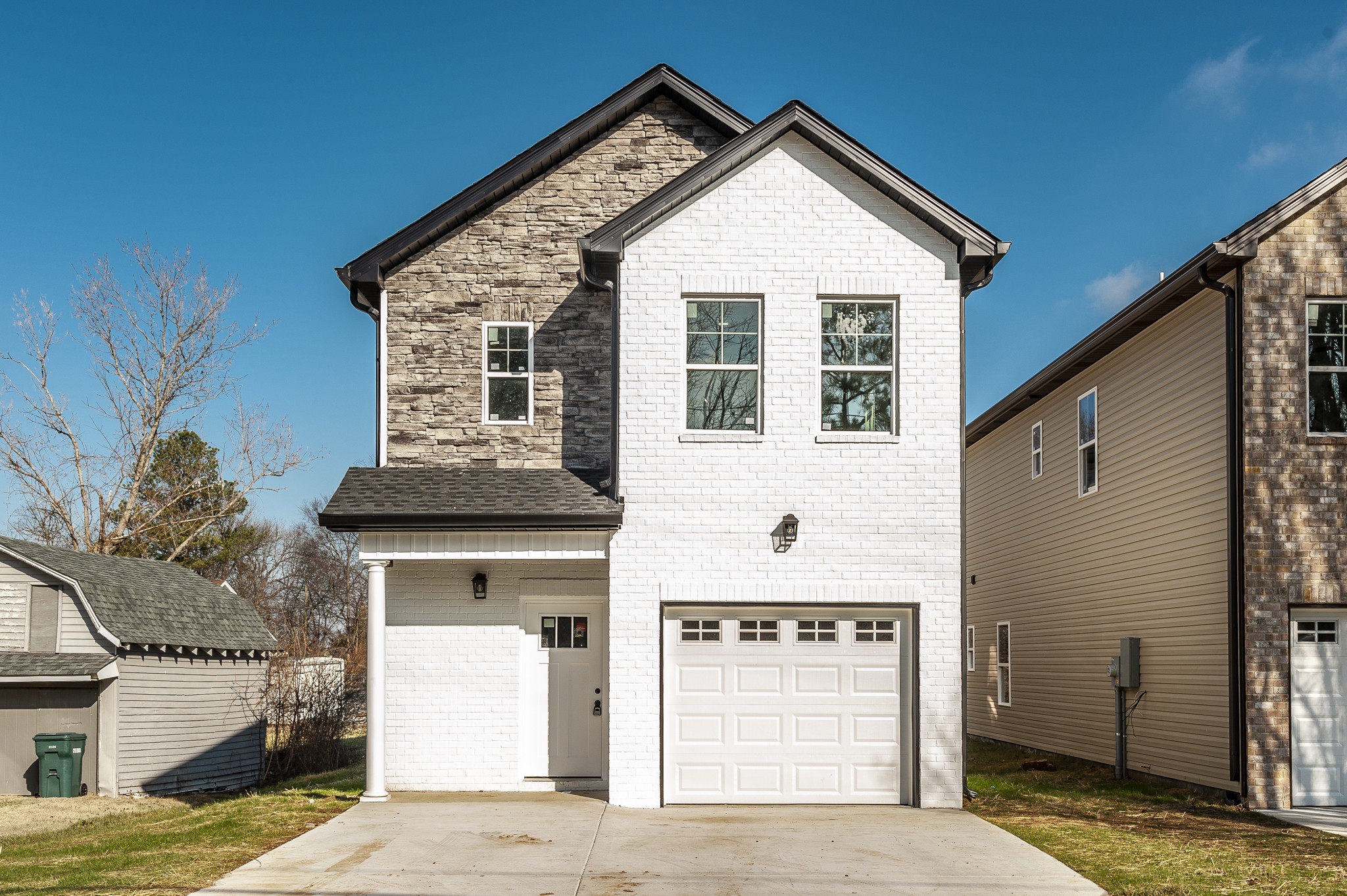 a front view of a house with a garage