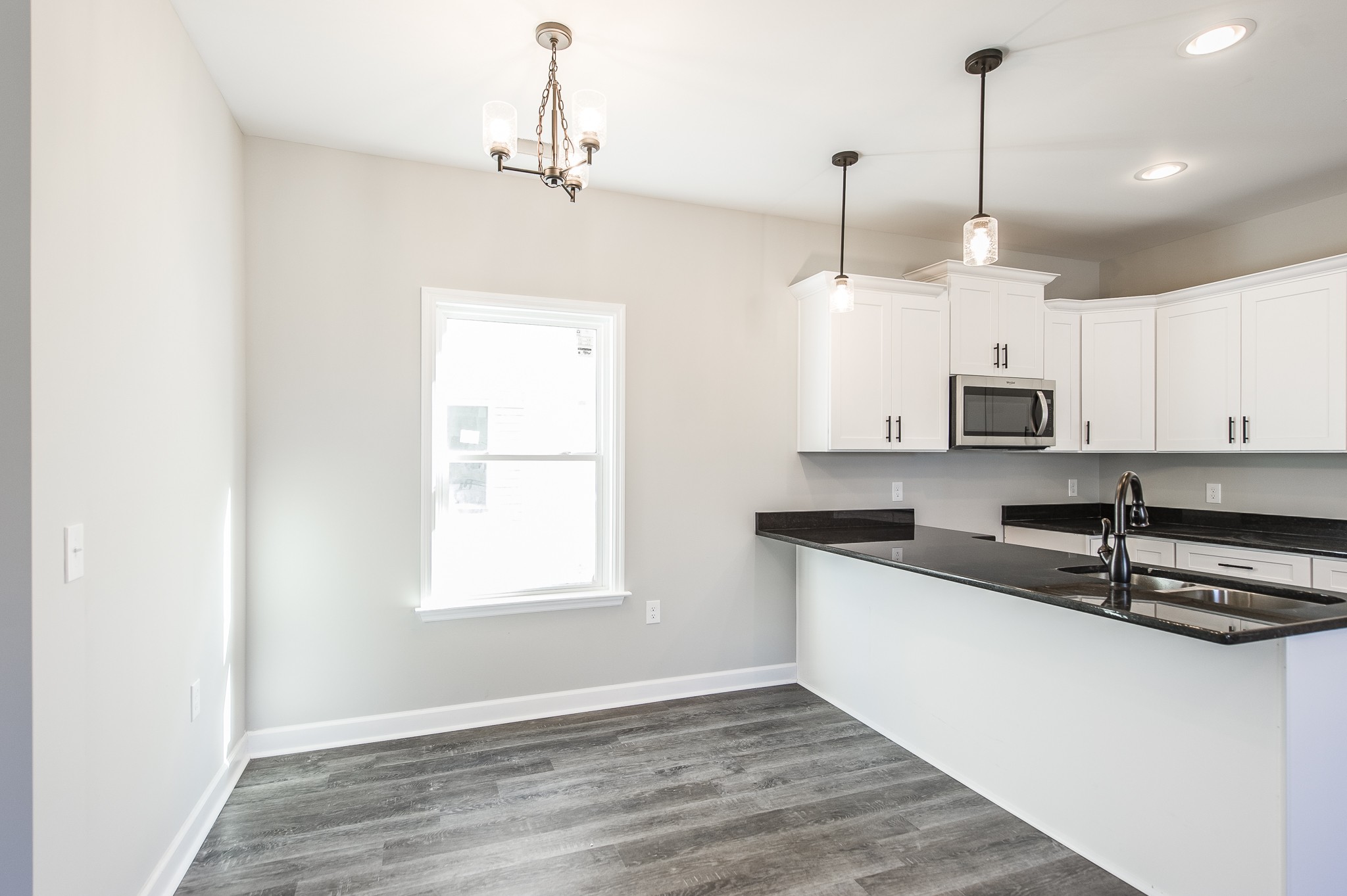 815 West Spring Street Lebanon, TN 37087 - Photo 11 of 32 a kitchen that has a microwave a sink and a window in it