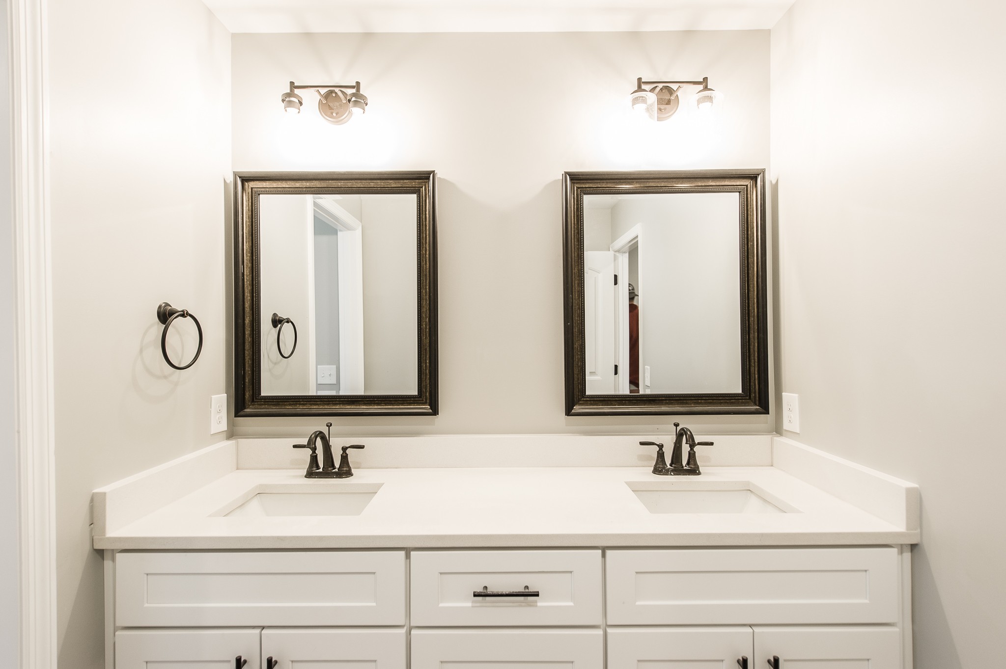 815 West Spring Street Lebanon, TN 37087 - Photo 17 of 32 a bathroom with double vanity sinks and a mirror