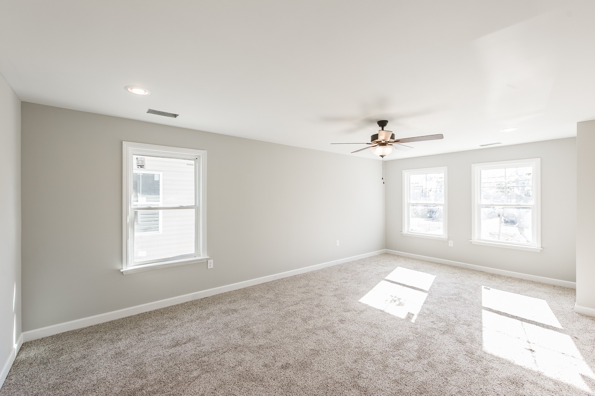 815 West Spring Street Lebanon, TN 37087 - Photo 26 of 32 an empty room with windows and chandelier fan