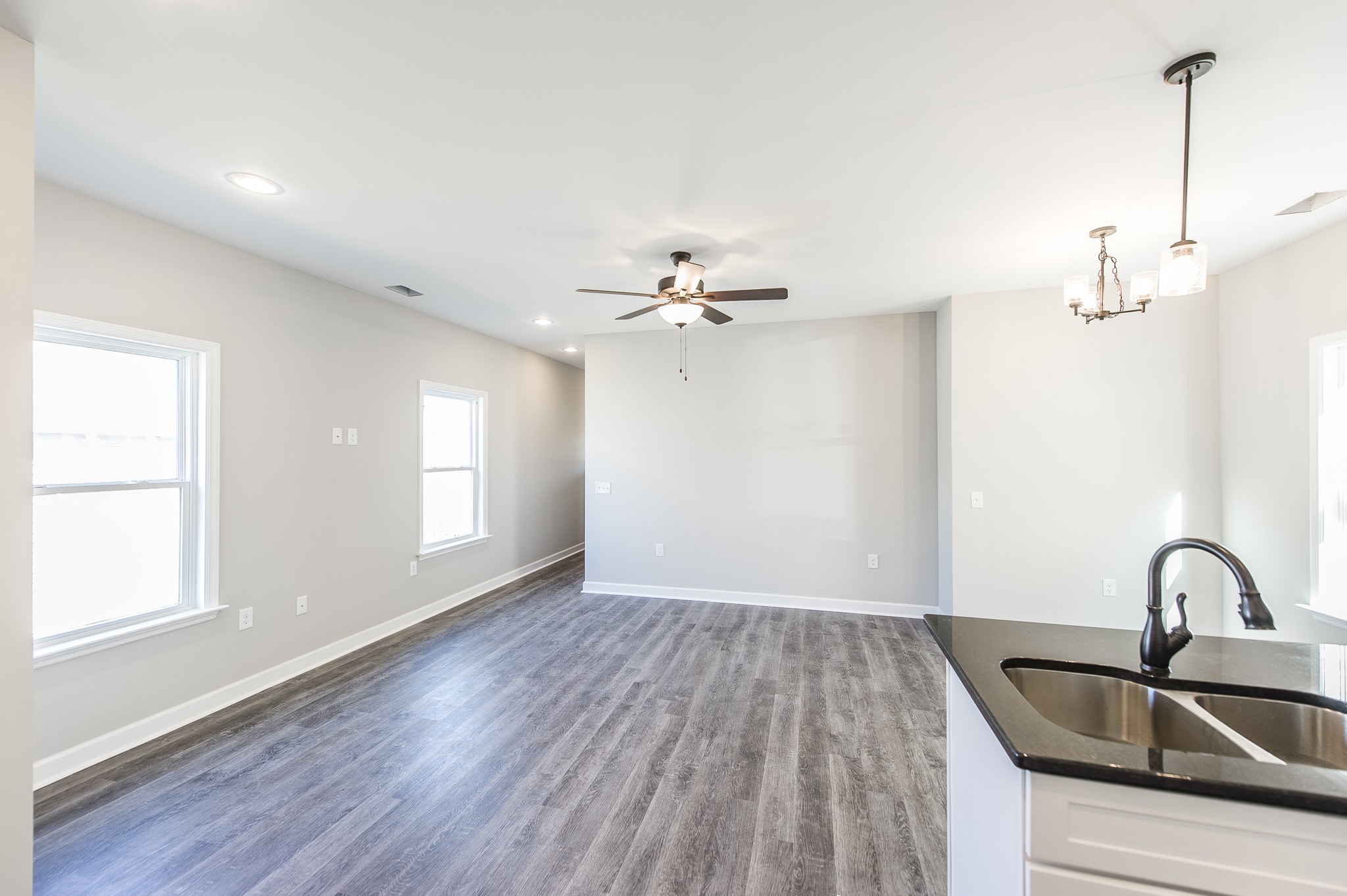 815 West Spring Street Lebanon, TN 37087 - Photo 7 of 32 a view of a sink and dishwasher with wooden floor