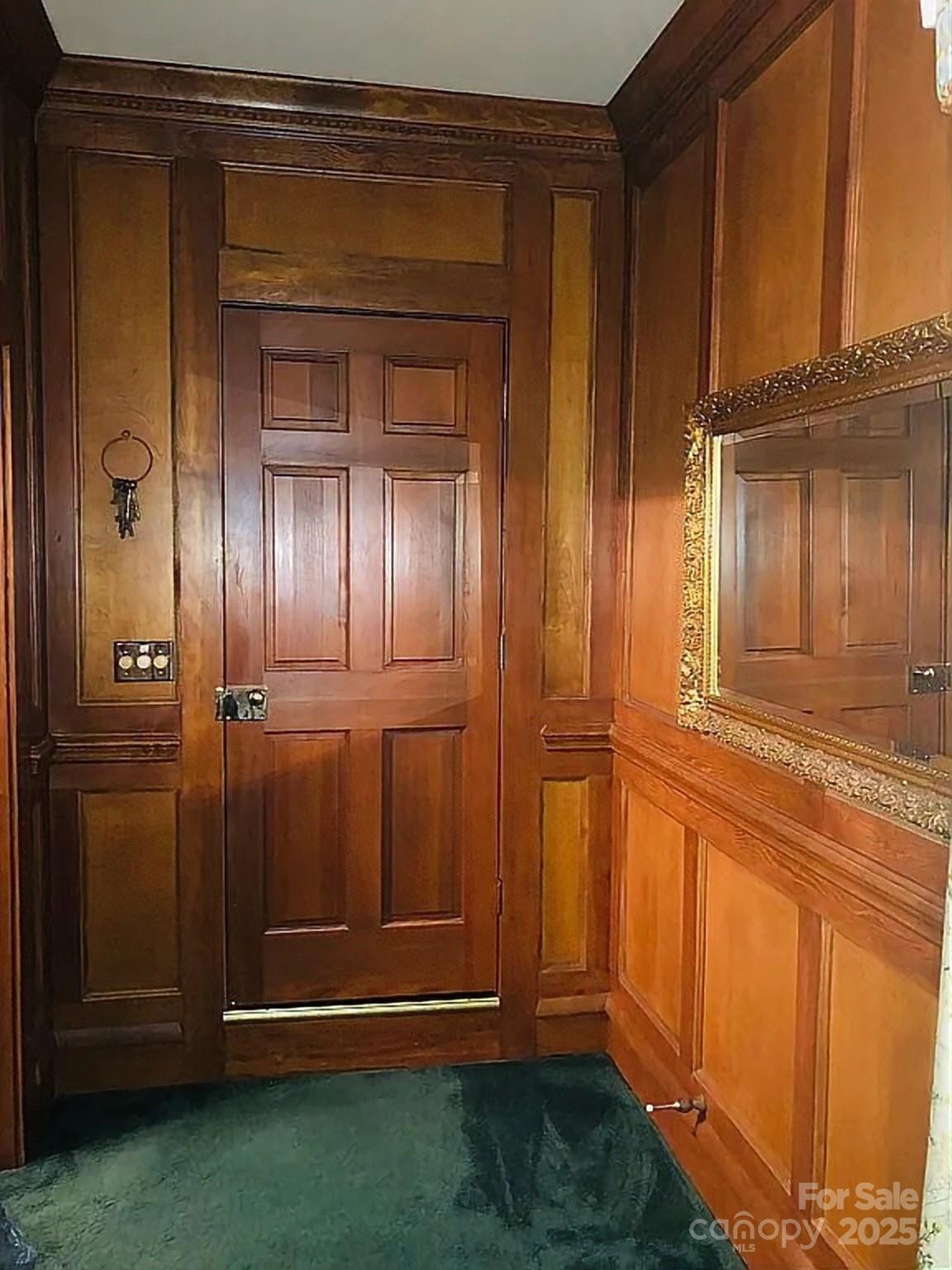 115 South Pearl Street Troy, NC 27371 - Photo 21 of 48 an empty room with wooden floor and cabinet