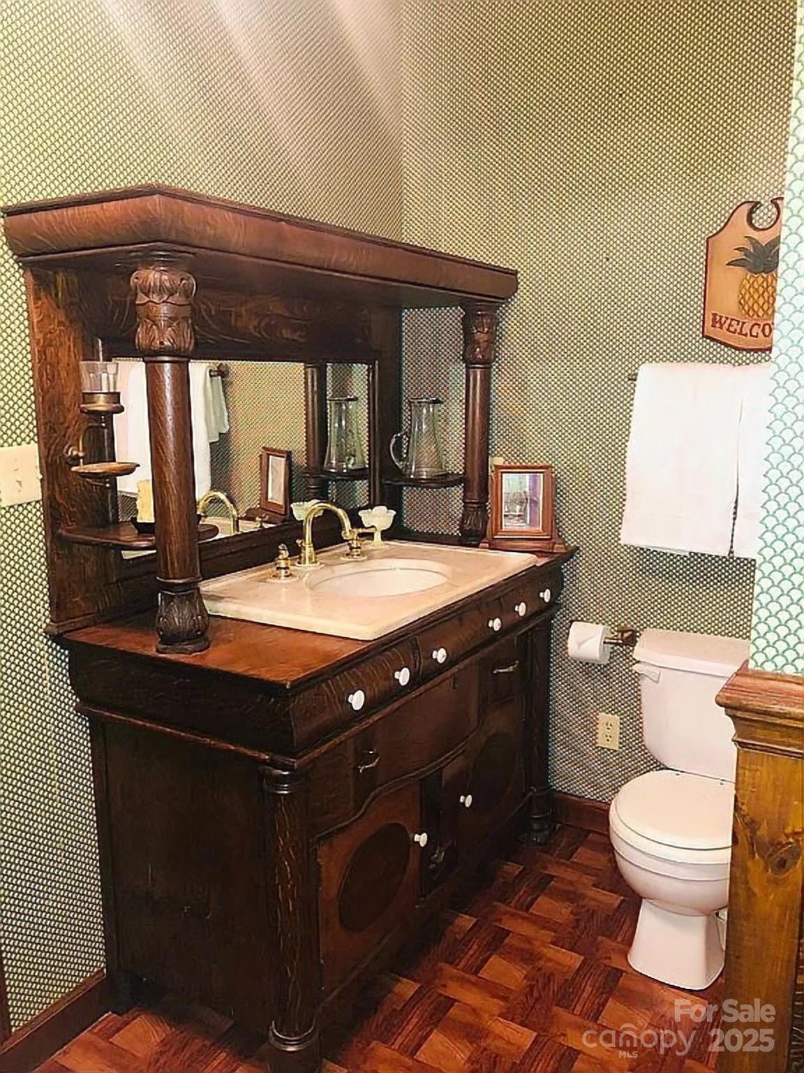 115 South Pearl Street Troy, NC 27371 - Photo 22 of 48 a bathroom with a sink vanity and toilet
