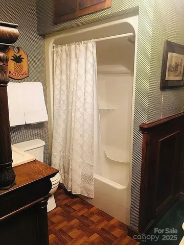 a kitchen with kitchen island a refrigerator a stove a dining table and chairs