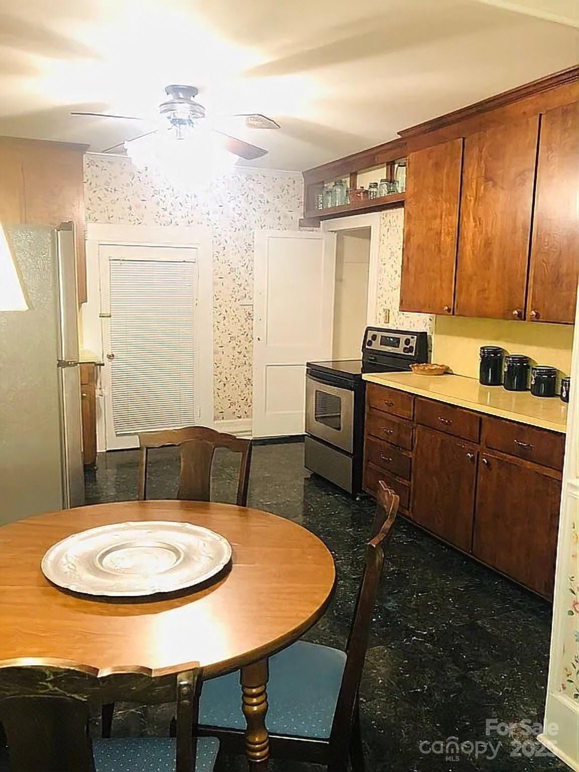 115 South Pearl Street Troy, NC 27371 - Photo 27 of 48 a view of a kitchen with a table and chairs in it