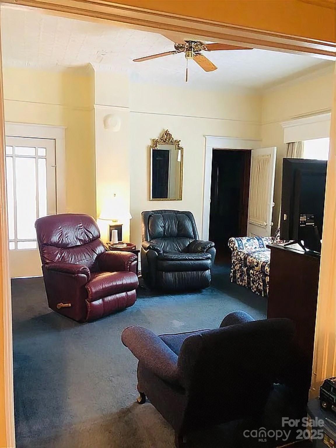115 South Pearl Street Troy, NC 27371 - Photo 29 of 48 a living room with furniture and a flat screen tv