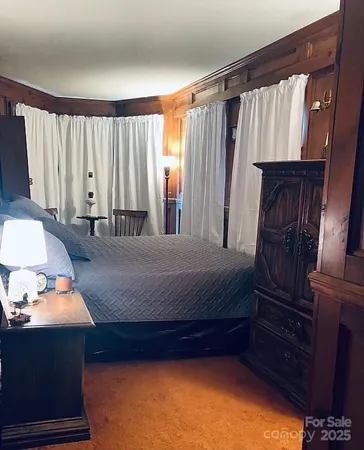 a view of bedroom with furniture and window