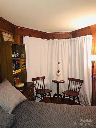 a living room with furniture flat screen tv and a fireplace