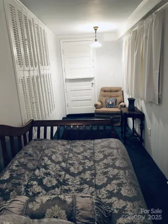 a living room with furniture a fireplace and a table