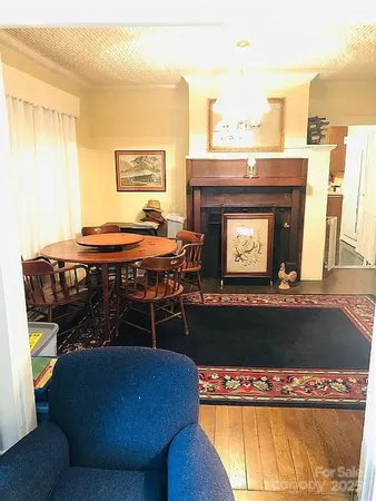 a room with pool table and windows